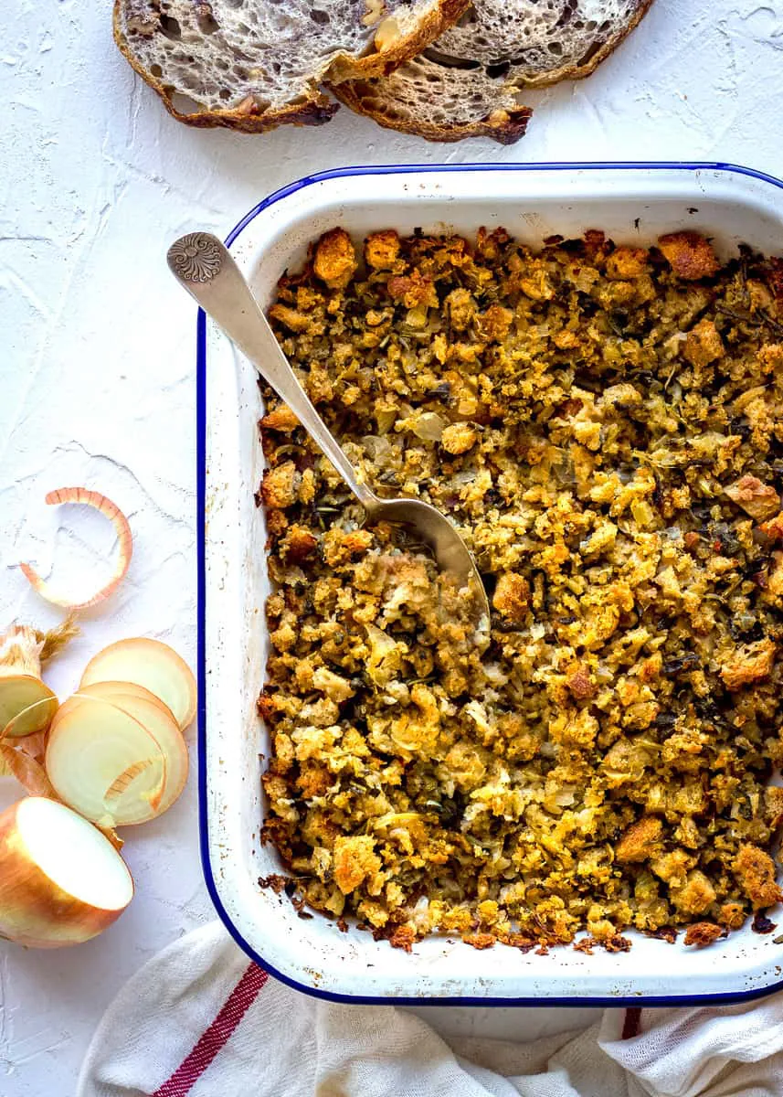 A tray of stuffing made with gluten free bread, sage and onions.