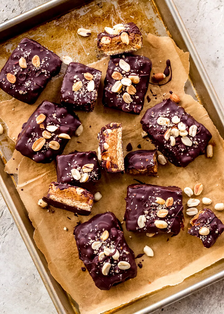 No bake snickers bars on a baking tray.