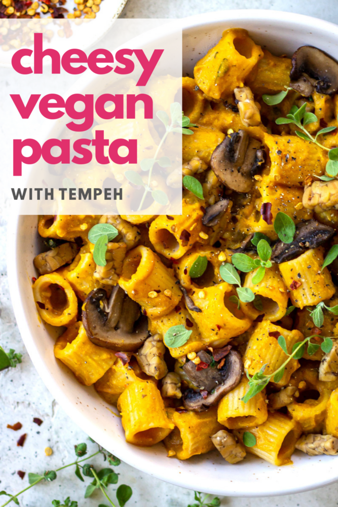 This Cheesy Vegan Pasta is the ultimate comfort food. With a cheese sauce made from sweet potato and coconut milk (really, it's delicious) and added sauteed tempeh and mushrooms for protein, it makes a great vegan dinner idea. Gluten free too. #vegan #pasta #sweetpotato #glutenfree #vegandinner #healthydinner