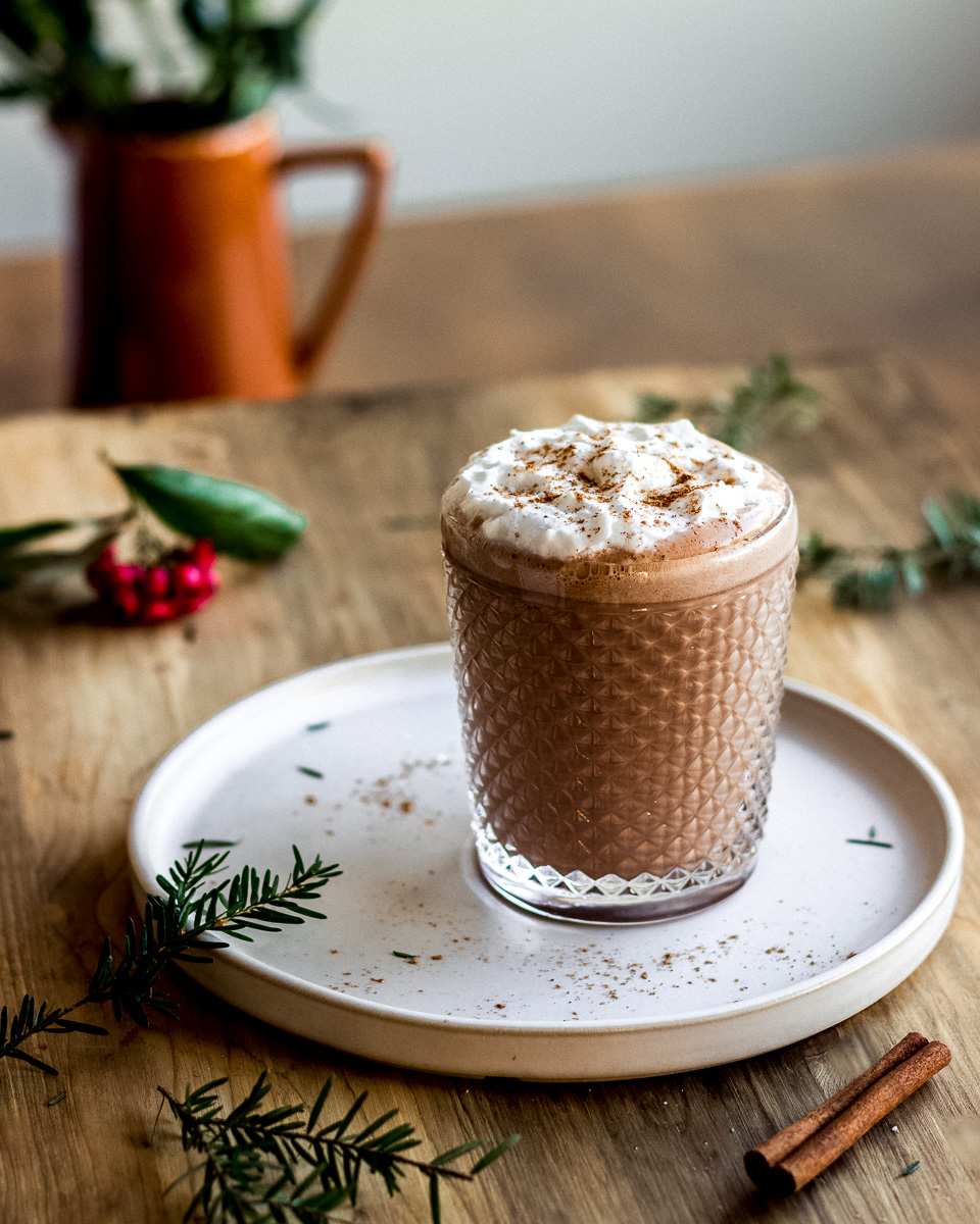 Vegan mint hot chocolate topped with whipped coconut cream.