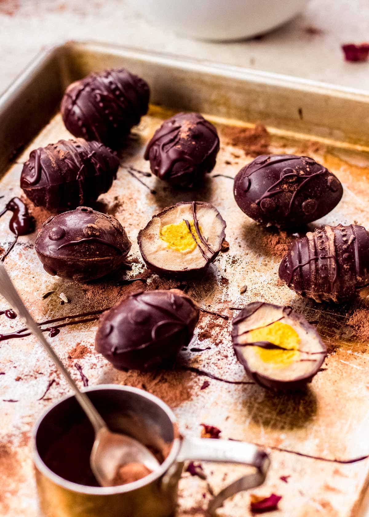 Homemade Cadbury Creme Eggs (vegan) on baking tray.
