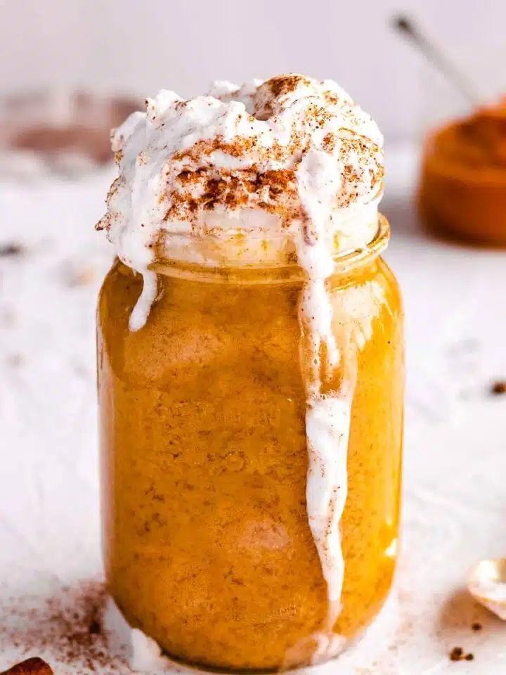 Iced pumpkin spice latte with whipped coconut cream.
