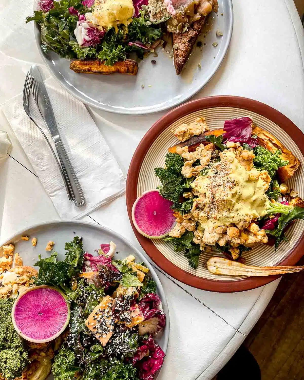 Colourful plates of food from Nourish Kitchen - best vegan restaurants in Victoria BC.
