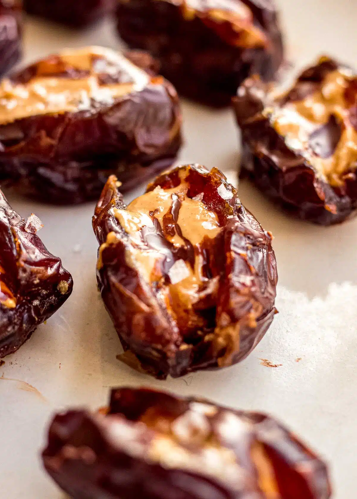 Dates halves and filled with peanut butter, covered in chocolate.