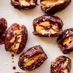 Stuffed dates with peanut butter, chocolate drizzle and sea salt flakes.