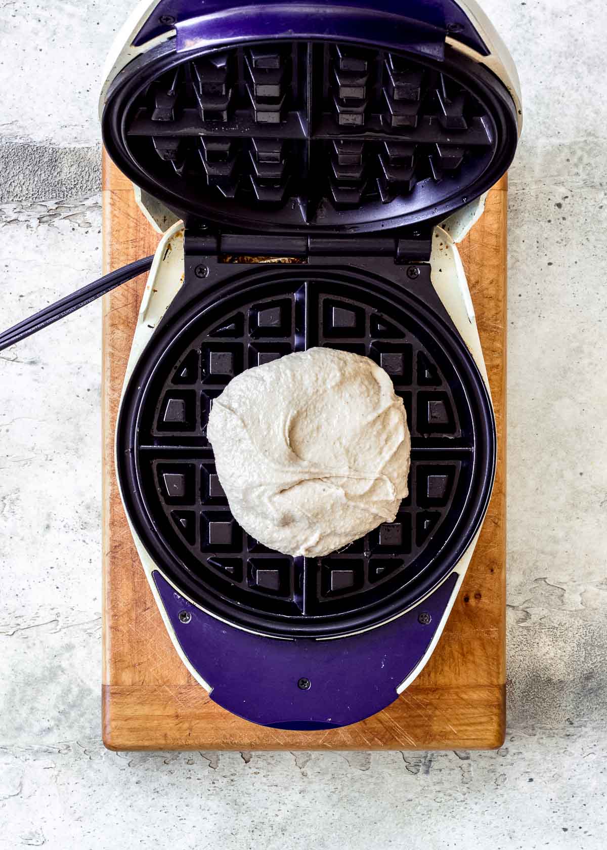 Uncooked 3 ingredient waffle batter in a waffle iron.