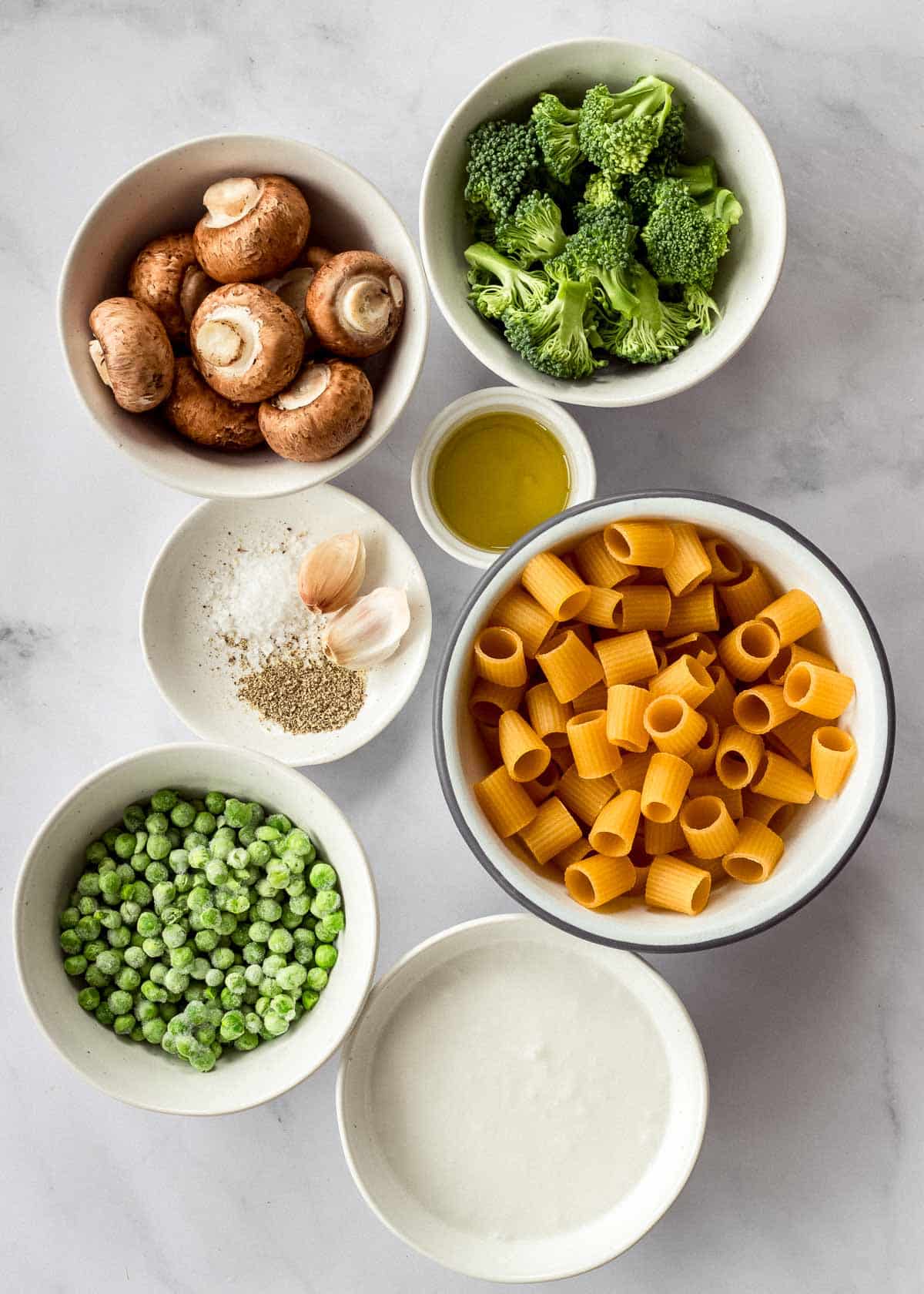 Ingredients for pasta with broccoli and mushrooms.