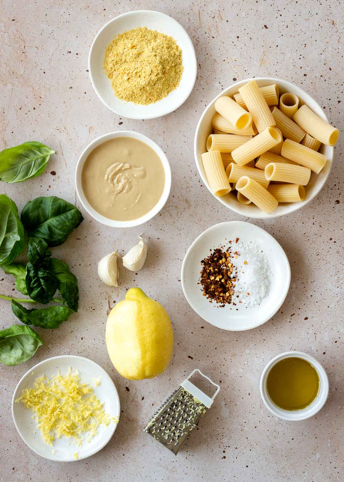 Tahini sauce ingredients, including tahini, lemon zest, pasta and basil